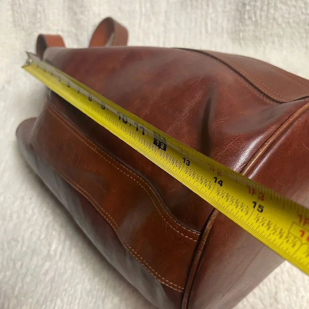 Fortune Duck vintage leather Brown sling back bucket style  bag.